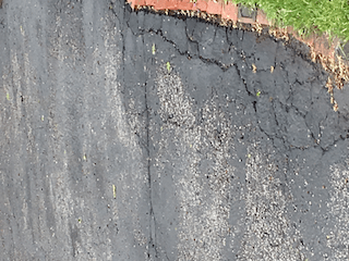 asphalt emulsion base on driveway after 1 year.png
