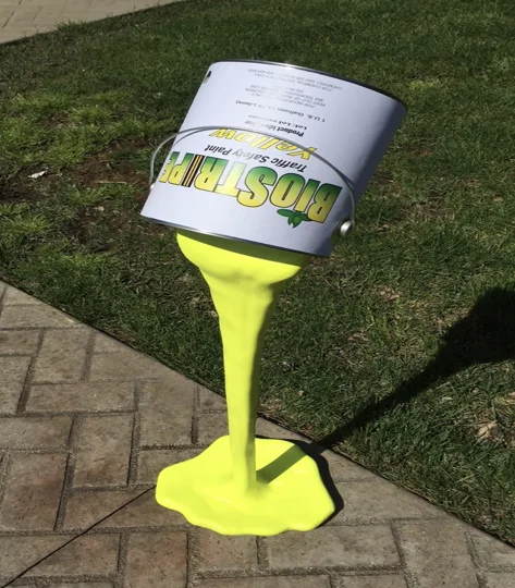 BioStripe Paint can pouring yellow paint
