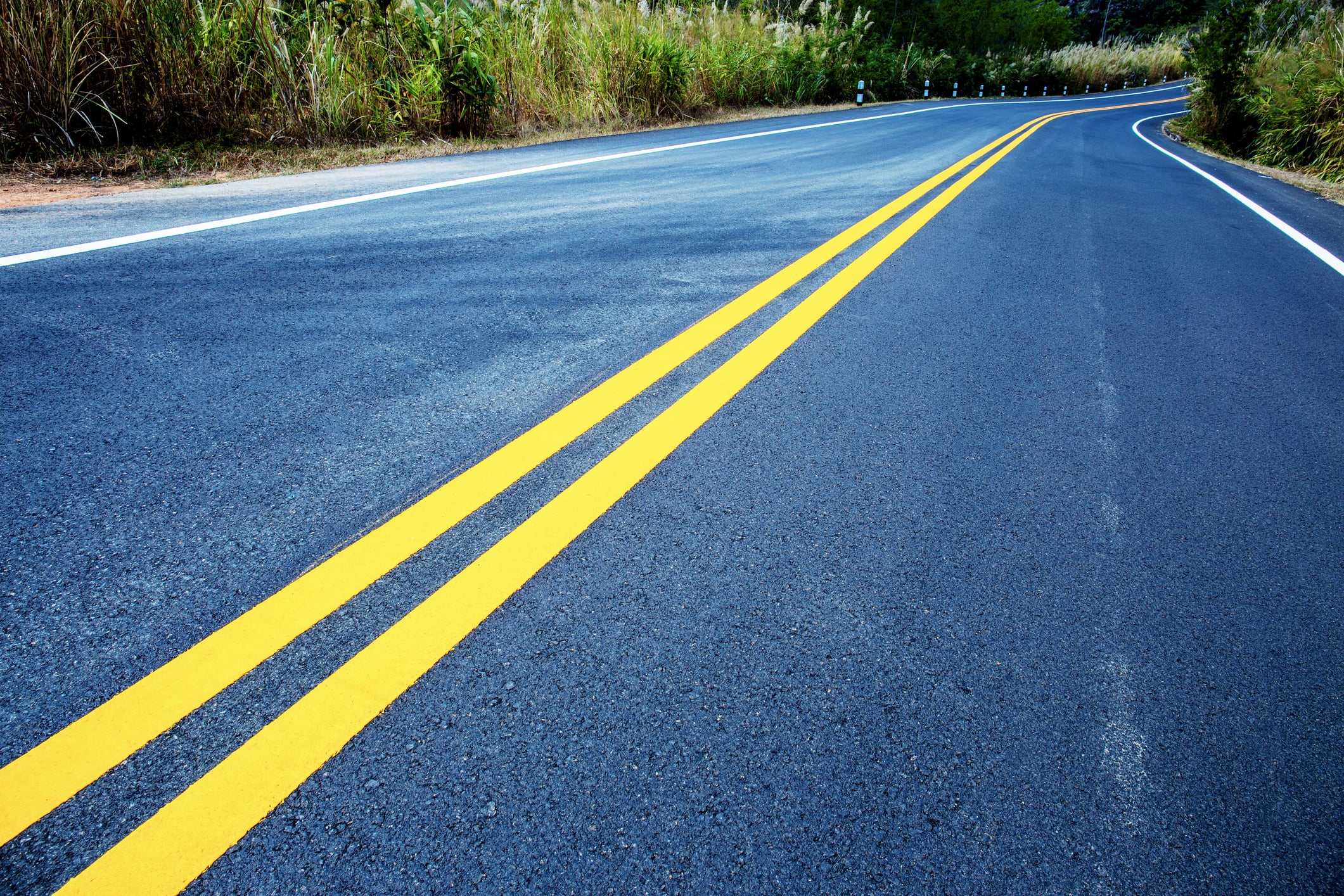 crisp yellow center lines on road